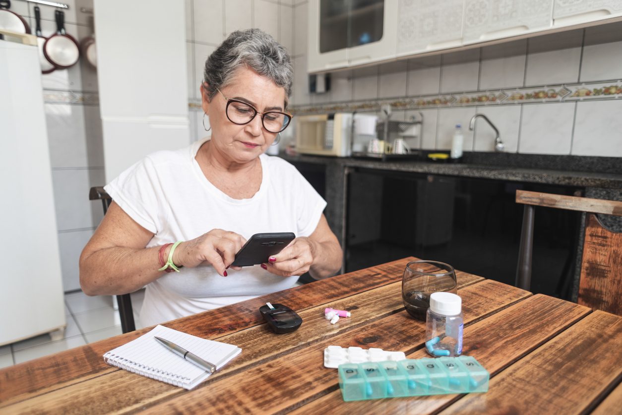 Woman testing blood sugar levels